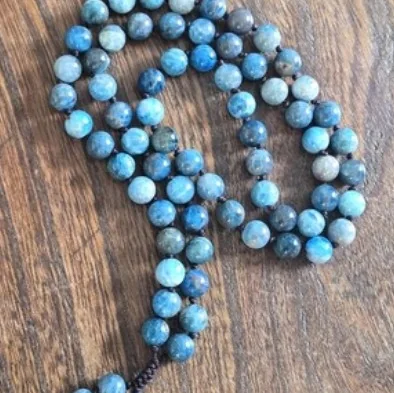 Hand-knotted mala necklace of 8 mm blue African turquoise beads on brown nylon cord