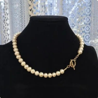 Another view of the Classic Pearl & Gold Toggle Collar Necklace