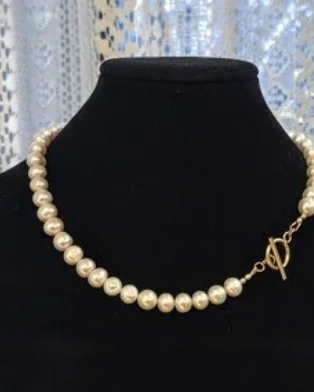 Another view of the Classic Pearl & Gold Toggle Collar Necklace