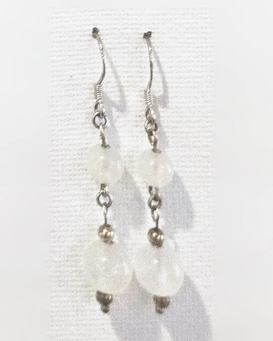 Two frosted white gemstone beads linked with 925 sterling silver on each ear hook