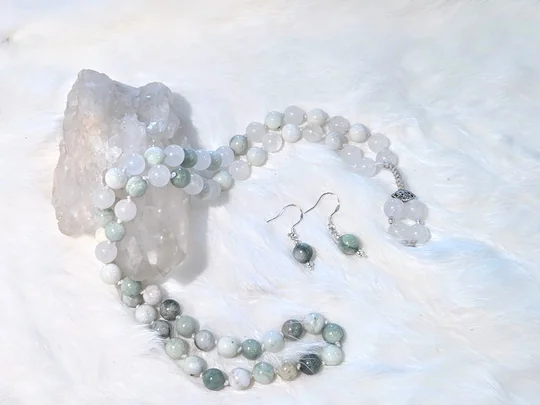 Hand-knotted mala necklace of white and soft green gemstone beads