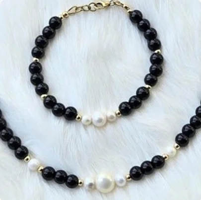 Another view of the Black Onyx, Pearl & 14k Gold-Filled Collar Necklace