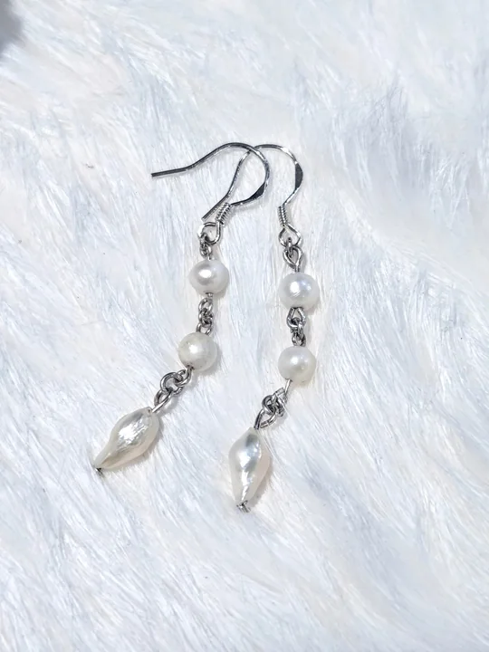 Another view of the Dainty White Pearl Dangle Earrings