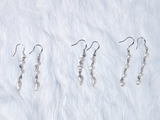 Another view of the Dainty White Pearl Dangle Earrings