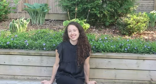 The maker of 4 the Love of Pretty Things, smiling in a summer garden